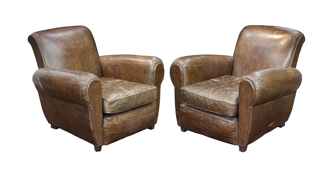 Pair of Art Deco style leather club chairs: Pair of Art Deco style leather club chairs, having brown upholstery, rounded arms, and rising on square legs, 32"h x 36"w x 33"d