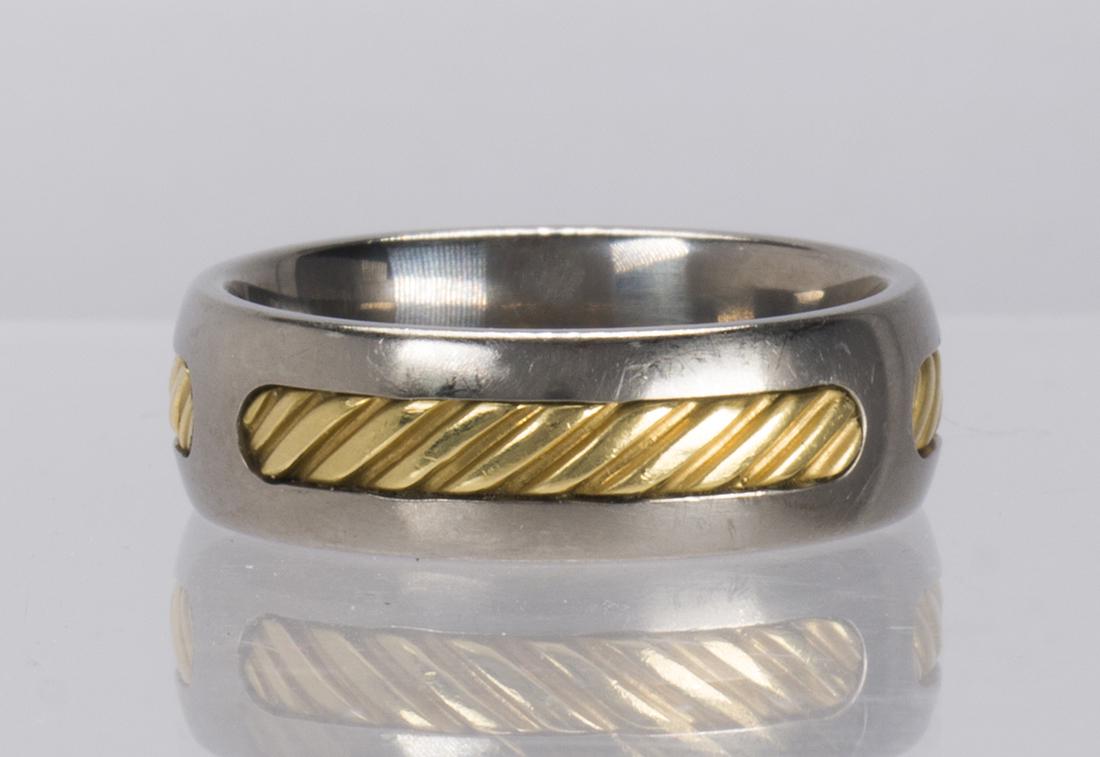 David Yurman titanium and 18k yellow gold band: David Yurman titanium and 18k yellow gold band The cable motif 18k and titanium band, measures approximately 7.3 mm in width, size 10, marked copyright DYT, 750, gross weight 6.32 grams