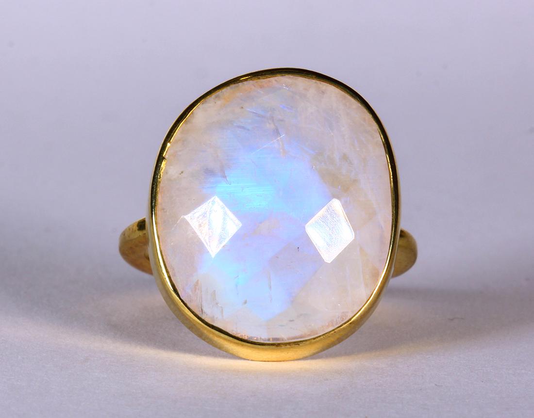 Moonstone and silver-gilt ring: Moonstone and silver-gilt ring Featuring (1) oval-shaped moonstone cabochon, measuring approximately 19 X 16 mm, set in a silver gilt mounting, size 5 1/4, gross weight 5.14 grams