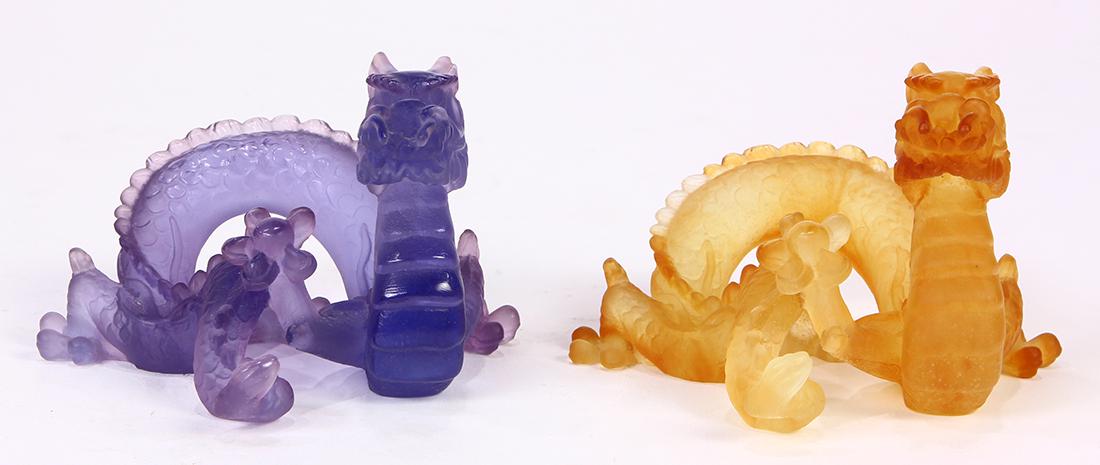 (lot of 2) Daum France Pate De Verre limited edition: (lot of 2) Daum France Pate De Verre limited edition crystal dragons, one executed in lavender numbered 749, one in caramel numbered 123, both from the edition of 2000, overall 3"h x 4.5"l; Provenance