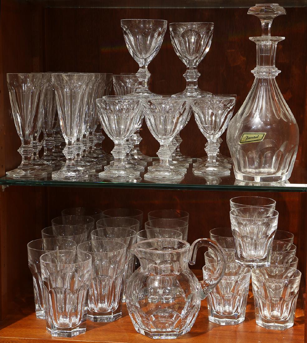 Baccarat crystal Harcourt pattern barware group, each: (lot of 48) Baccarat crystal Harcourt pattern barware group, each having a cut body, consisting of (12) champagne flutes, (12) wine glasses, (10) tumblers, (12) iced tea, decanter, and pitcher, each w