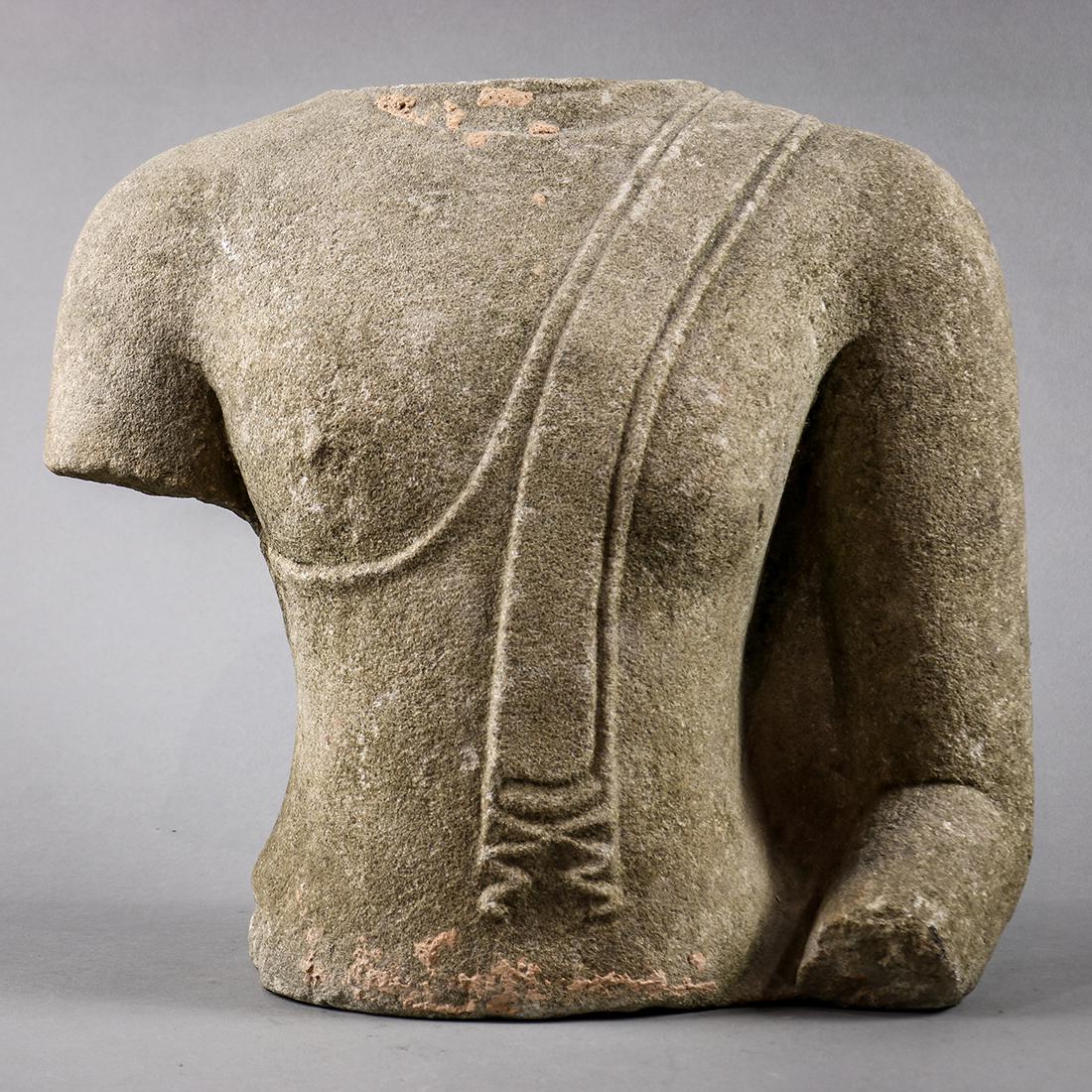 Thai Sandstone Carving of a Torso: Thai sandstone torso, adorned in a simple monk's robe with fabric draping down the left shoulder, 13"h