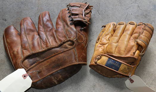 Vintage leather baseball gloves: (lot of 2) Vintage leather baseball gloves, consisting of a 1940's leather five finger baseball glove, 10"w; together with a Franklin child's finger glove