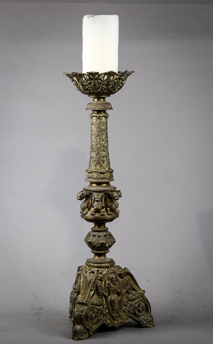 Spanish Renaissance style candelabra circa 1870: Spanish Renaissance style candelabra circa 1870, the decorated standard with mythological winged creatures surmounting the reticulated base centered with Jesus Christ flanked with angels, and rising o