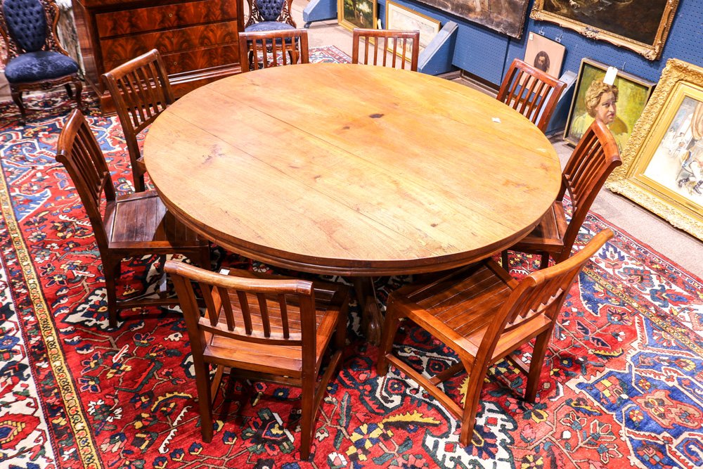 British Colonial style dining suite: (lot of 9) David Smith & Co. British Colonial style dining suite, consisting of a large dining table having a carved pedestal base accented with a carved figural and floral frieze, and rising on outsw