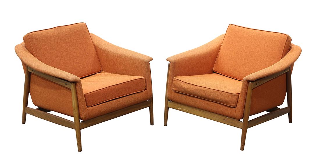 Pair of Scandinavian Dux lounge chairs: Pair of Scandinavian Dux lounge chairs, each having orange upholstery and rising on tapered legs, 28"h x 32"w