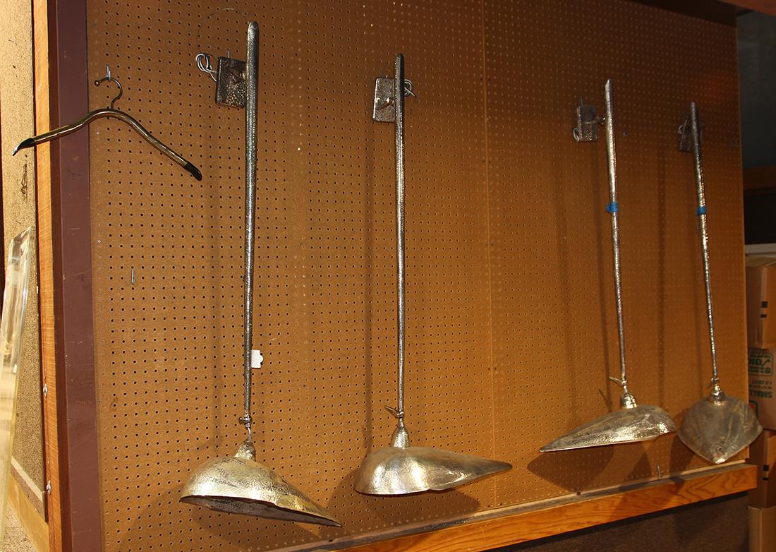 Custom silvered and hammered wall sconces: (lot of 4) Custom silvered and hammered wall sconces, each having a two socket cluster with tear drop adjustable shade, 48"h
