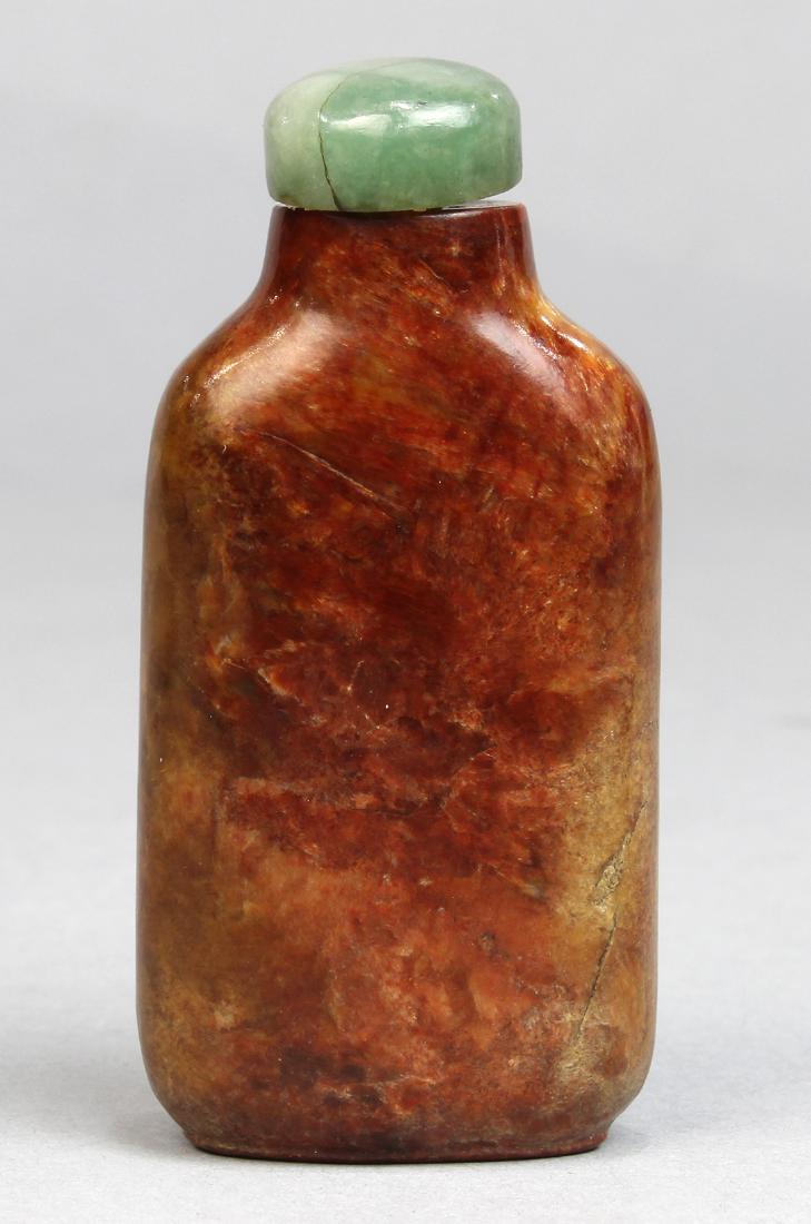 Chinese Mottled Brown Hardstone Snuff Bottle: Chinese hardstone snuff bottle, with a short cylindrical neck and canted shoulders above a flattened body, executed from a brown and tan mottled matrix, 2.25"h
