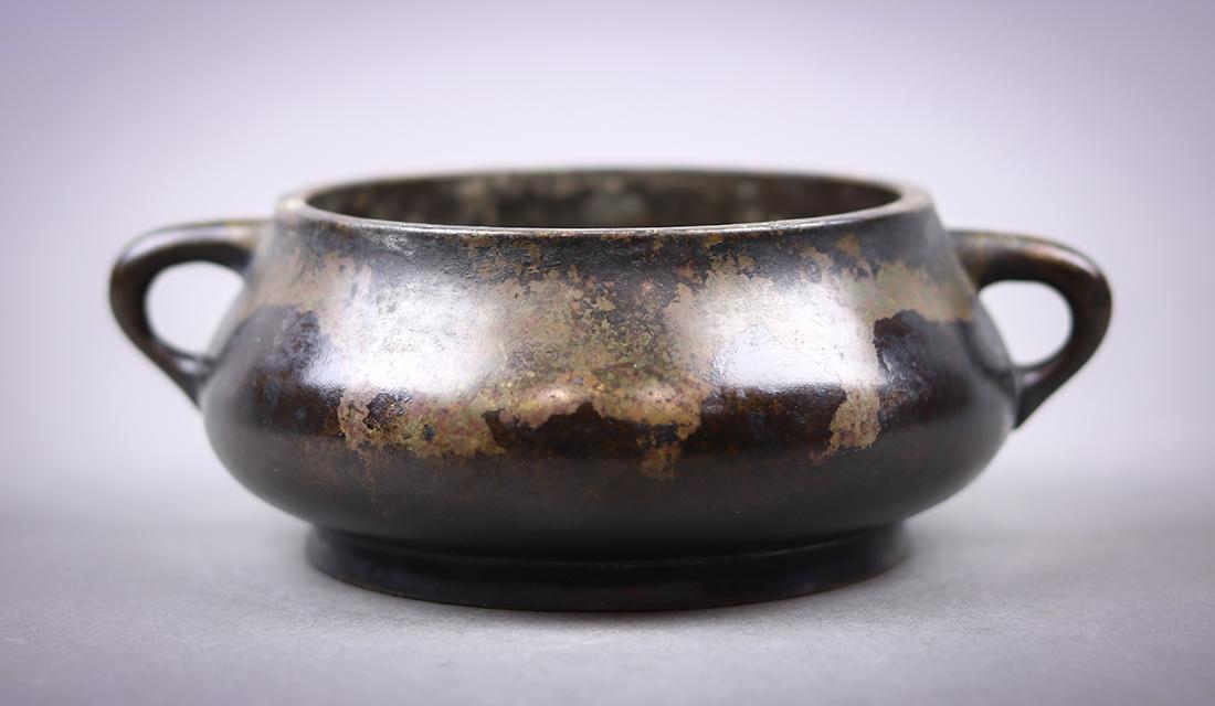 Chinese Bronze Censer, Xuande Mark: Chinese patinated bronze censer, with a low slung body flanked by handles, base with apocryphal Xuande mark, 6.25"w