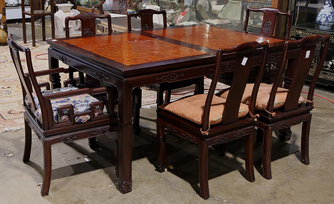 Chinese Dining Table and Chairs: (lot of 9) Chinese dining table and eight chairs, the table top inset with burl wood panels, above an apron with scroll pattern in relief; together with two armchairs and four side chairs featuring ch