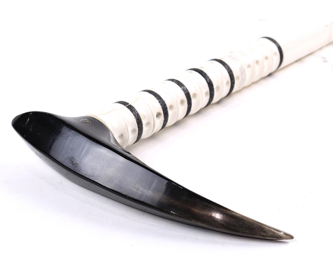 Inuit carved bone walking stick or cane: Inuit carved bone walking stick or cane, having an antler handle above a circular carved shank, 34"l