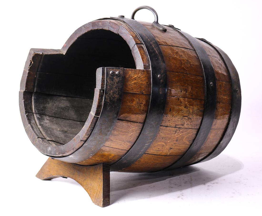 Primitive wooden barrel, resting on a separate support, (1 of 3)