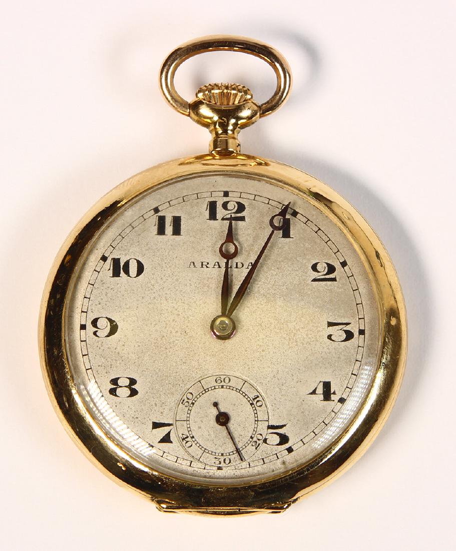 18k yellow gold and metal, open face, pendant-watch: 18k yellow gold and metal, open face, pendant-watch Dial: round, textured, silvered, black stylized Arabic numeral hour markers, black outer minutes track, sunken subsidiary seconds dial at 6:00, blac