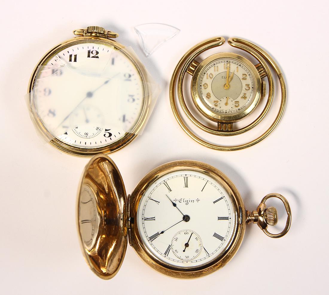 (Lot of 3) Gold-filled watches: (Lot of 3) Gold-filled watches Including 1) Elgin 15 jewels, stem set and wind, gold-filled, 25.29 mm, open face, money clip watch, monogrammed JMT on case; 1) Elgin mechanical stem set and wind, gold