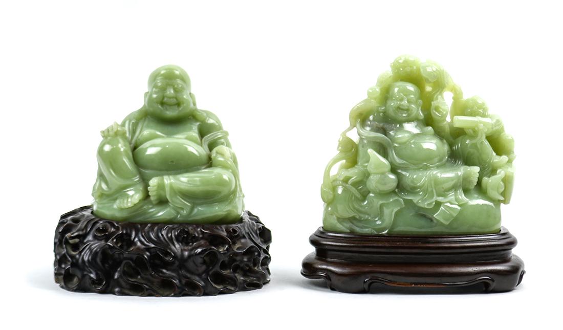 Chinese Hardstone Statues of Budai: (lot of 2) Chinese Buddhist hardstone sculptures: the first, of Budai wearing a loose robe sitting in royal ease; the second, of the smiling Budai holding a gourd in his right hand and a scroll in the