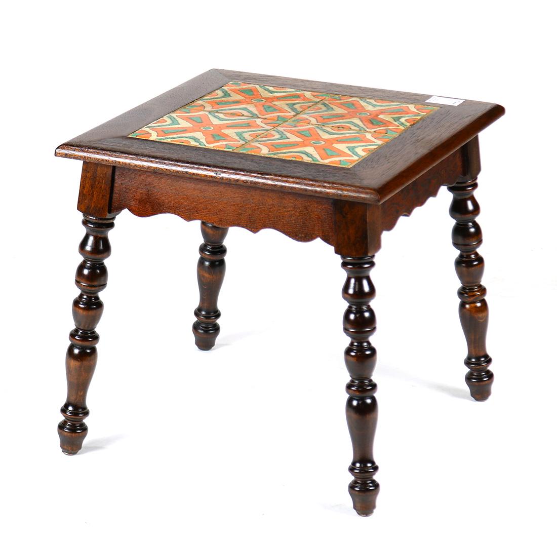 Arts and Crafts tile top tabouret: Arts and Crafts tile top tabouret, having a square top with inset tiles having geometric accents, and rising on turned legs, 16.5"h x 17.5"w