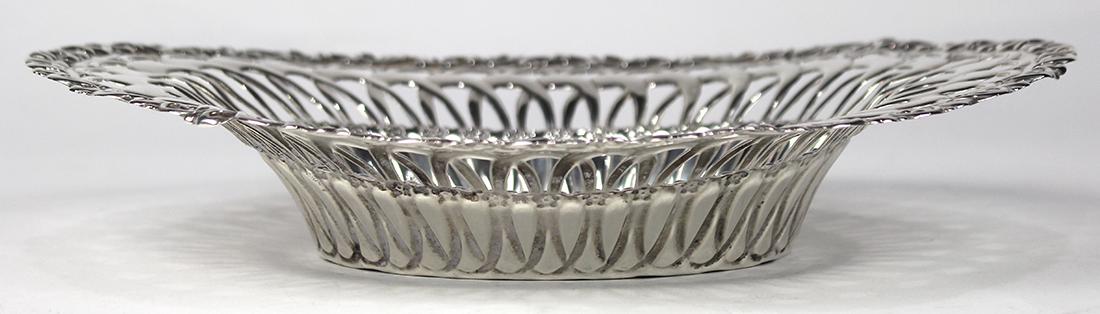 American sterling silver reticulated bowl, 20th: American sterling silver reticulated bowl, 20th century, by Whiting Manufacturing Co., having an oval form with stylized scrollwork and rosettes, 10.5"l x 8"w, 7.29 troy oz.