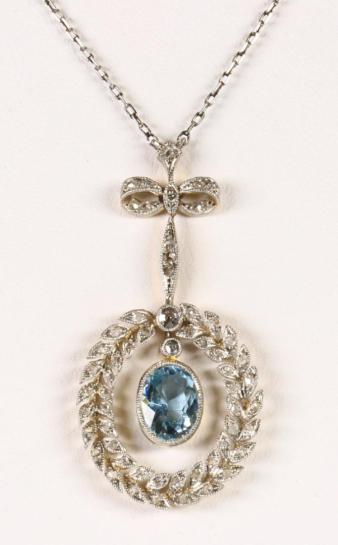 Edwardian aquamarine, diamond, platinum-topped 14k: Edwardian aquamarine, diamond, platinum-topped 14k yellow gold lavaliere necklace Centering (1) oval-cut aquamarine, weighing approximately 0.85 ct., surmounted by (1) old single-cut diamond, accented