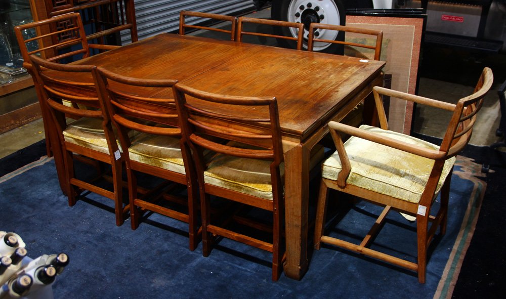Dining Table and Set of Chairs: Chinese style dining table, inset with floating top panels, with bead edge apron and square section supports on hoof terminals; together with a set of eight chairs with railed back splat, and mustard