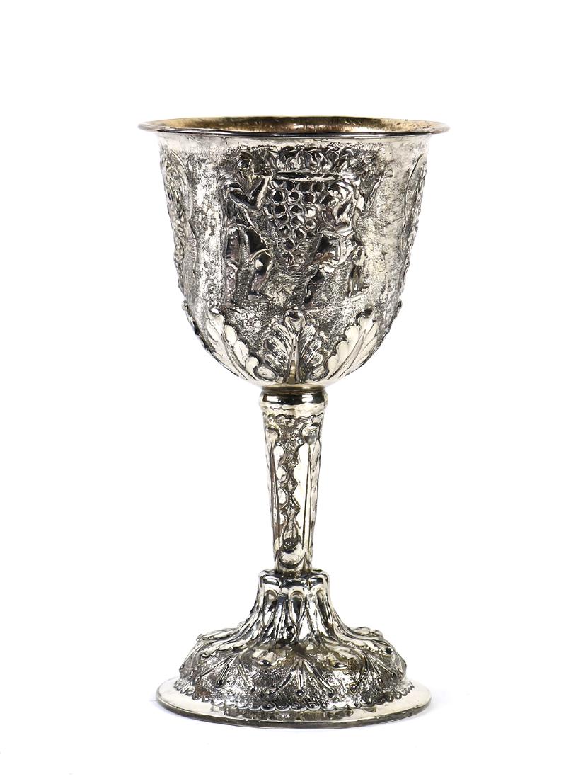 Silver cast wine goblet: Silver cast wine goblet, with a flared lip and an interior gilt washed bowl, the exterior decorated with figural reserves and rising on a circular base, 7"h x 3.5"dia.; total approx. silver weight 6 T