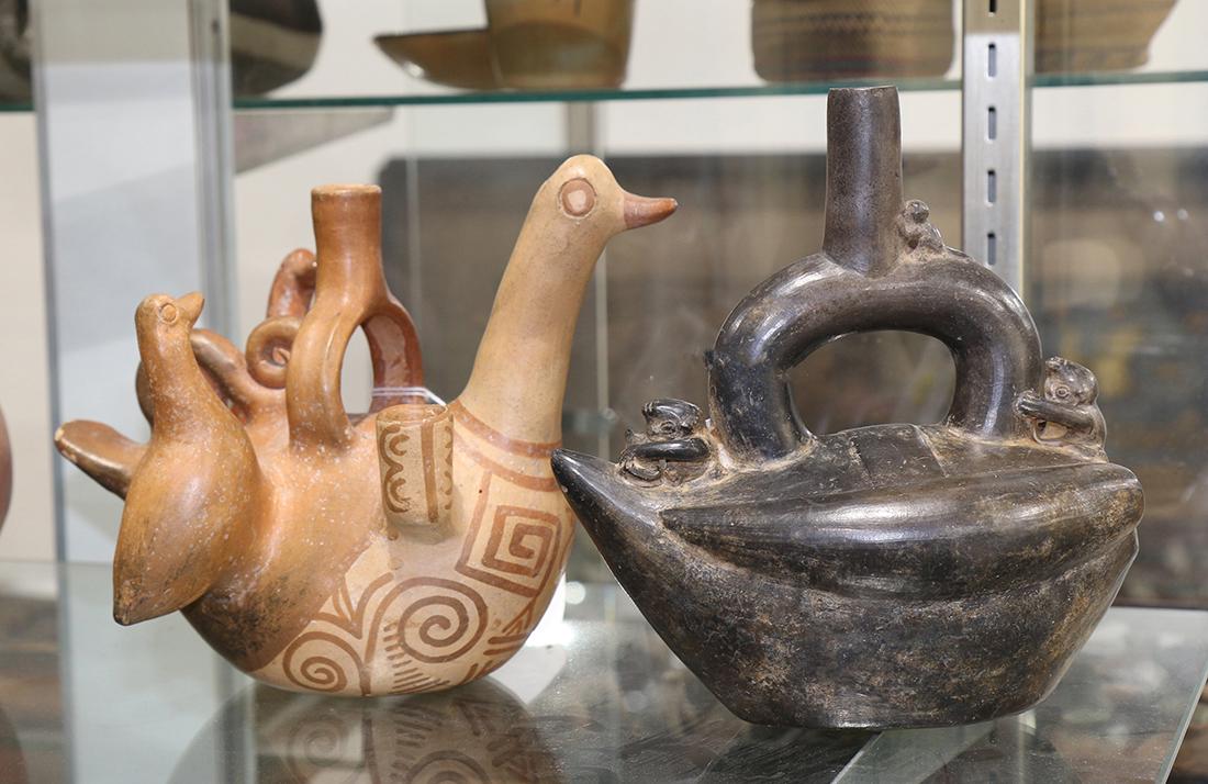 Chimu ceramic blackware stirrup vessel, depicting a (1 of 1)