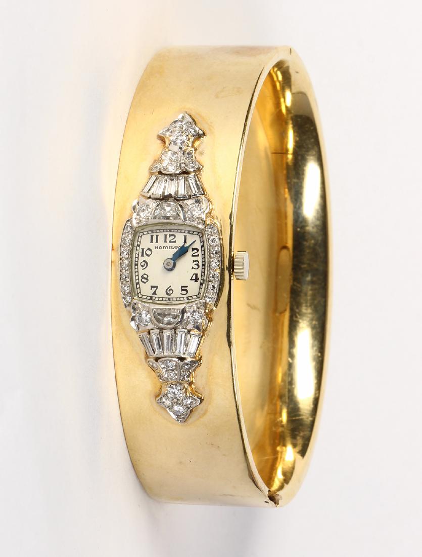 Diamond, platinum and 14k yellow gold wristwatch (1 of 2)