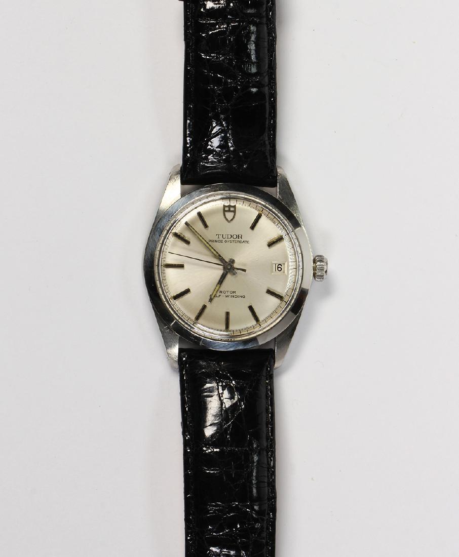 Tudor stainless steel wristwatch: Tudor stainless steel wristwatch Ref. 90500 Dial: round, silvered, black and silver baton hour markers, black outer minutes track, luminous dot markers, luminous baton hands, center sweep seconds hand