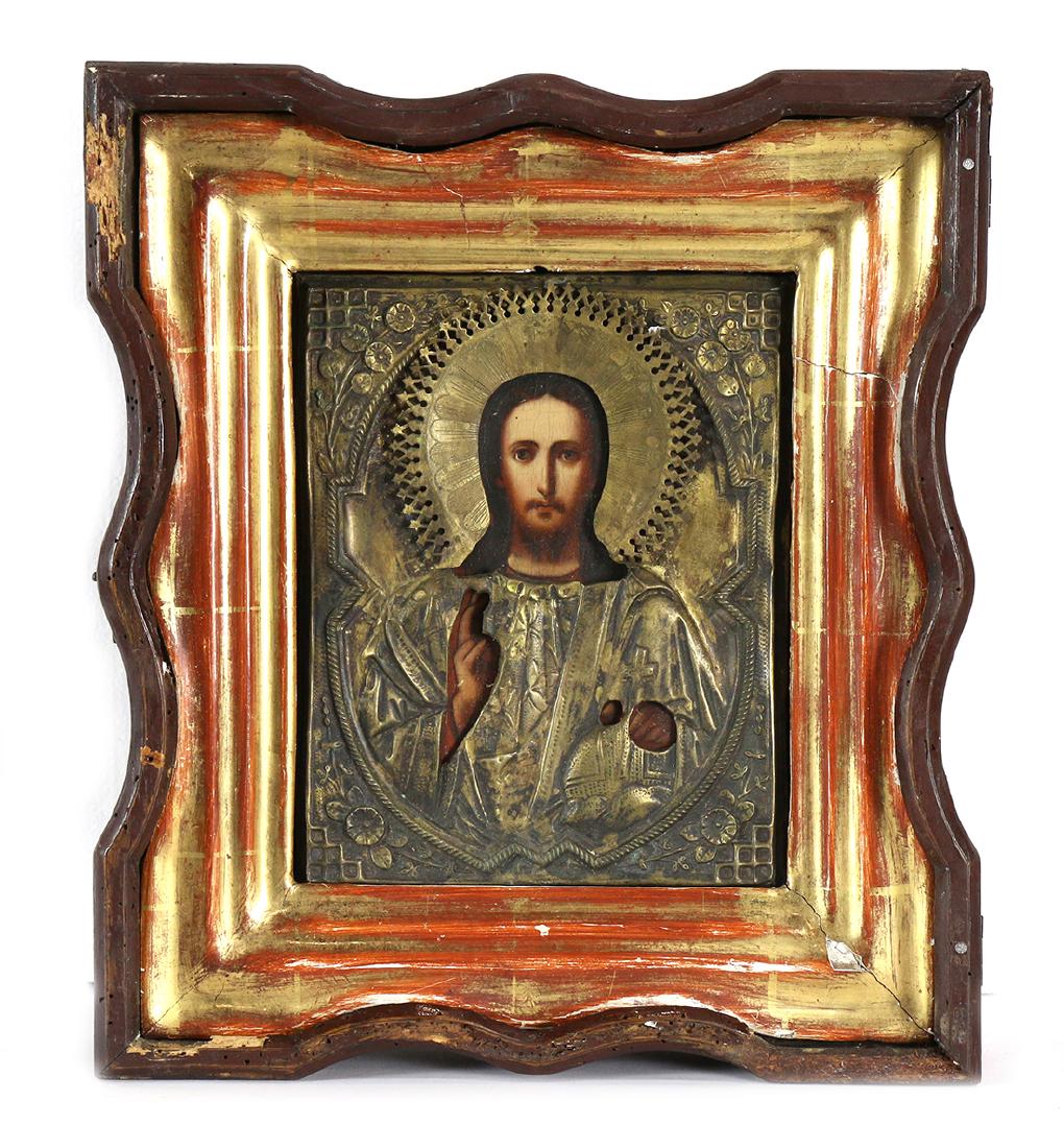 Russian oklad icon: Russian oklad icon, having a gilt metal oklad over the wood panel depicting Christ Pantocrator, 8.5"h x 7", encased in a wood kiot, having a shaped frame, 3"h x 12"w x 13.5"d
