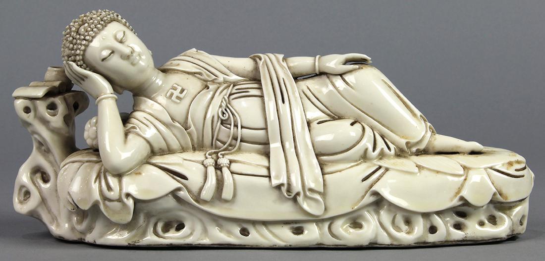 Chinese Blanc de Chine Parinirvana Buddha: Chinese blanc de chine porcelain Buddha, the reclining figure in parinirvana, studio mark on back, on wood stand, 10.5"w