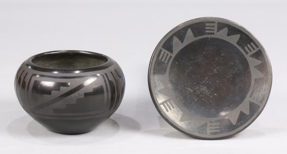 (lot of 2) San Ildefonso black on black table articles,: (lot of 2) San Ildefonso black on black table articles, consisting of a bowl and small plate signed Marie and Santana, largest: 6.5" dia.