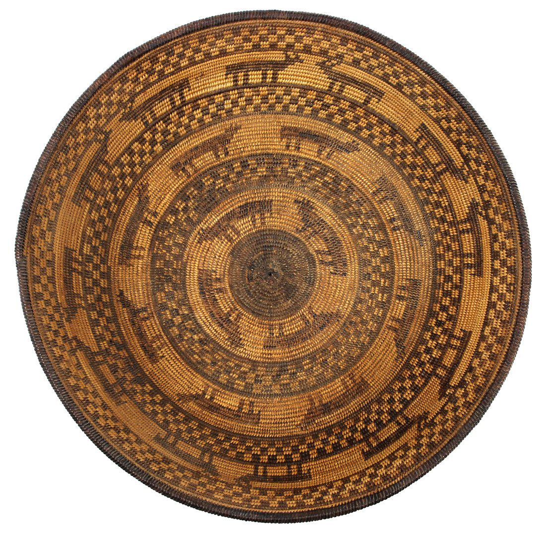 Pictorial Native American Apache basket, well and: Pictorial Native American Apache basket, well and tightly woven with depictions of deer or cattle between concentric bands of two-toned grids, 13"dia