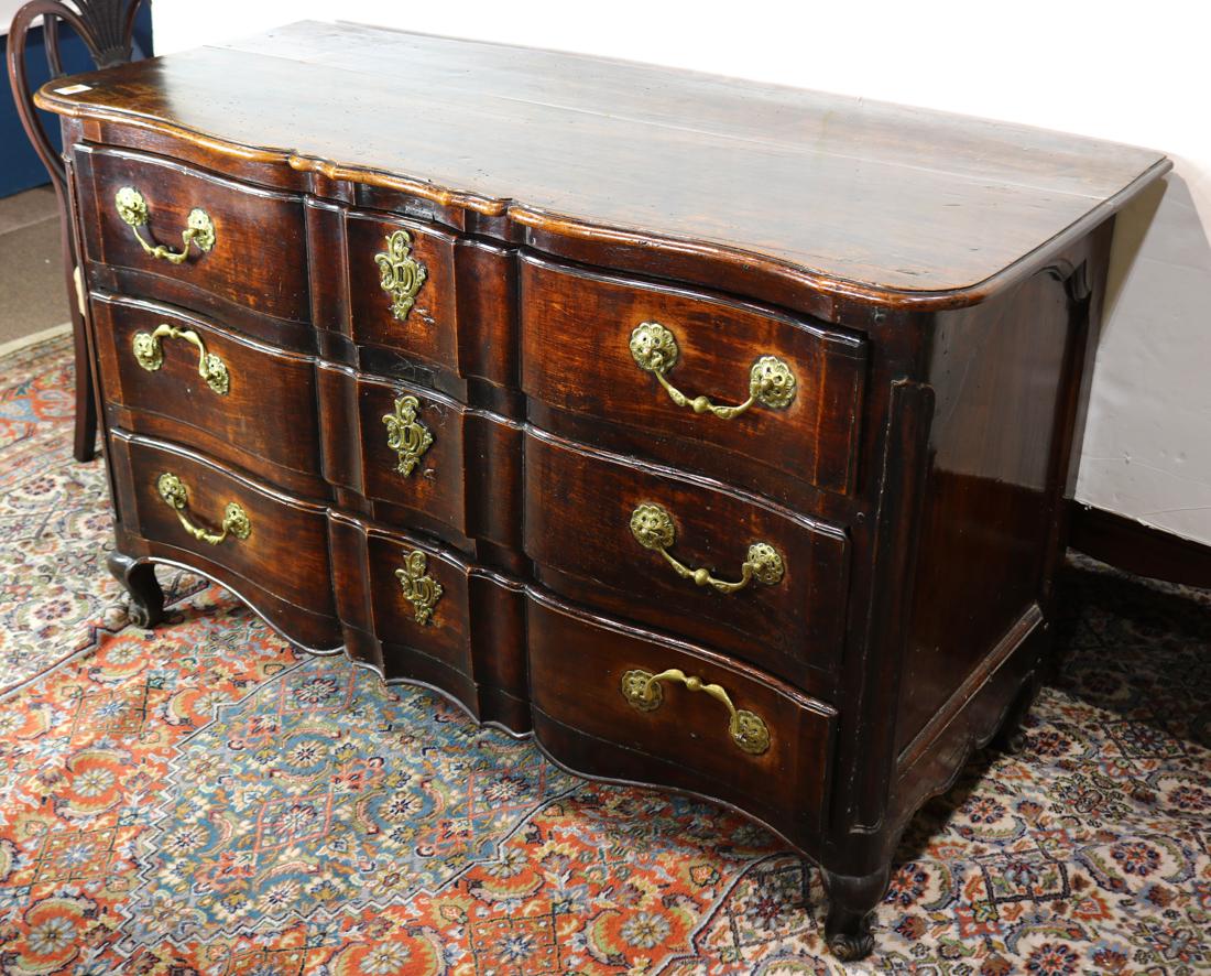 Louis XV walnut sideboard: Louis XV walnut sideboard, 18th century, having a shaped top above the three drawer case and rising on short cabriole legs, 34.5"h x 57"w x 23.5"d