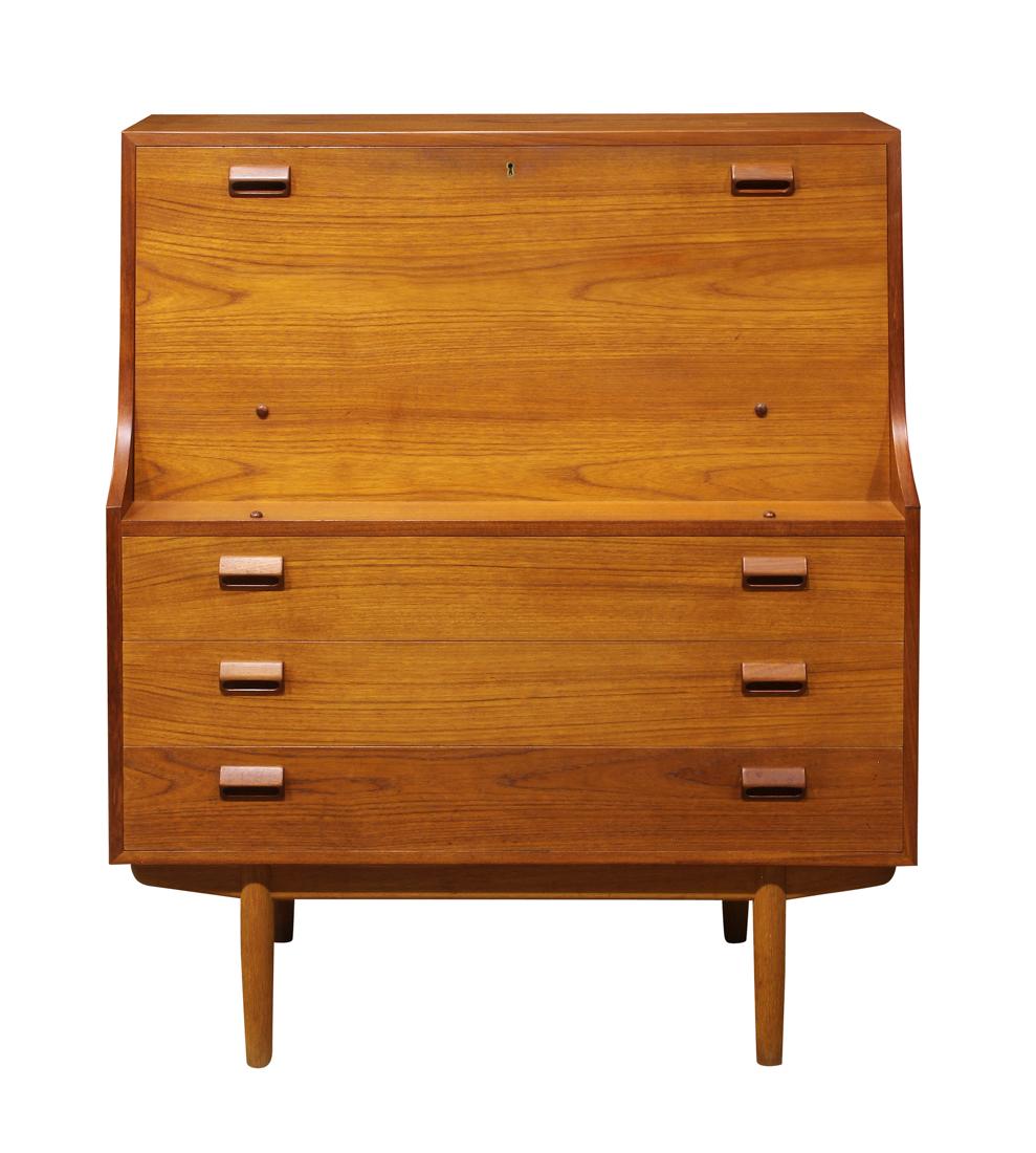 Danish Modern Børge Mogensen drop front desk: Danish Modern Børge Mogensen drop front desk, having a rectangular top, above a fall front opening to a fitted interior, above the three drawer case, and rising on tapered legs, 47"h x 39"w x 18"d