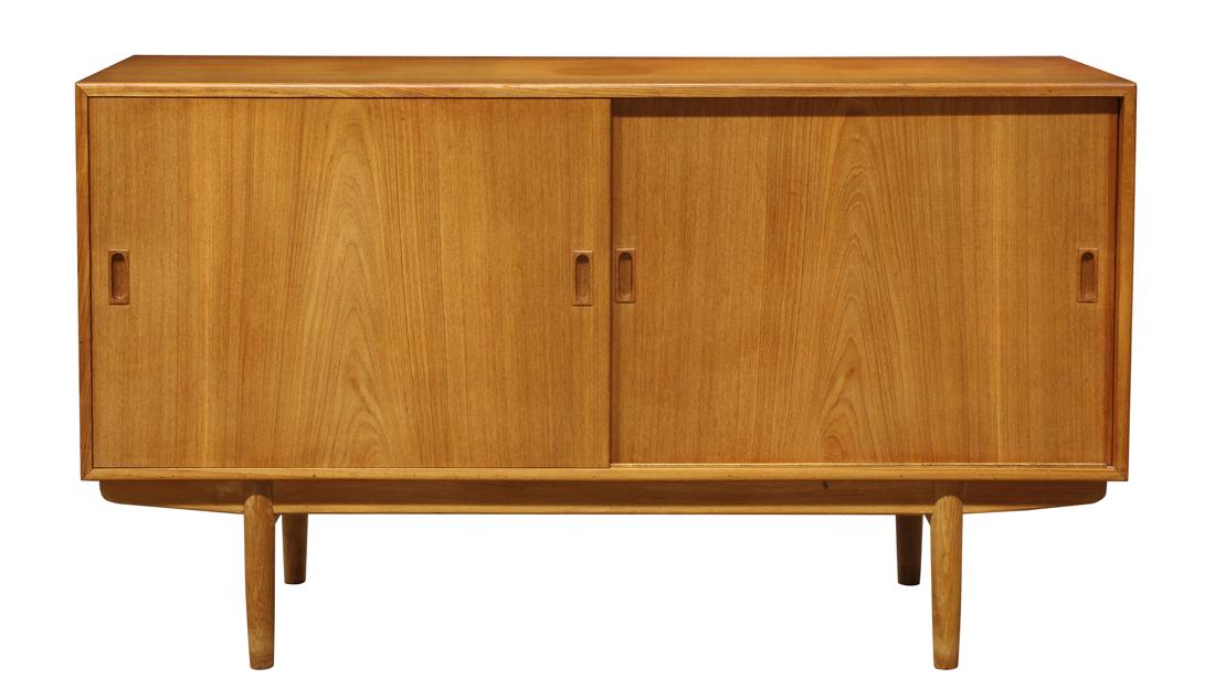 Danish Modern Børge Mogensen credenza: Danish Modern Børge Mogensen credenza, having a rectangular top, above two sliding doors, and rising on tapered legs 34"h x 59"w x 18"d