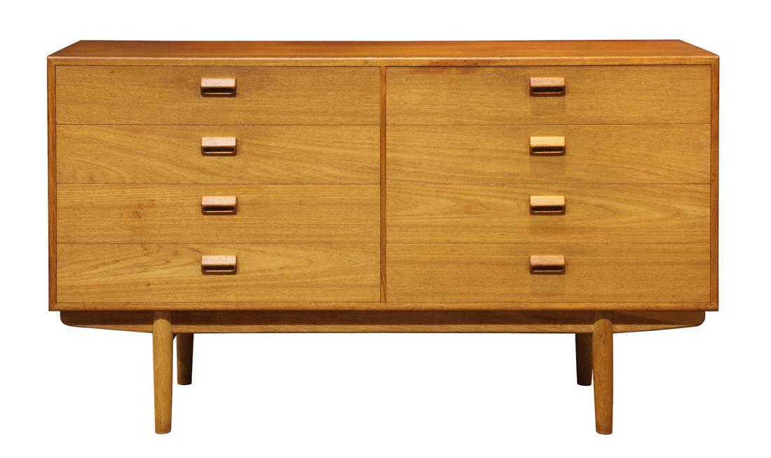 Danish Modern Børge Mogensen chest: Danish Modern Børge Mogensen chest, having a rectangular top, above the eight drawer case, and rising on tapered legs, 34"h x 59"w x 18"d