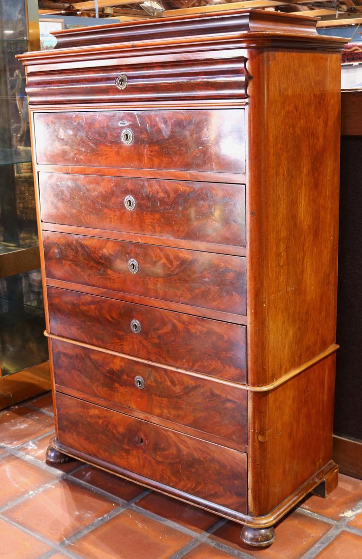 Biedermeier mahogany chest of drawers circa 1820: Biedermeier mahogany chest of drawers circa 1820, having seven drawers with highly figured fronts, and rising on compressed ball feet, 62"h x 40"w x 20"d