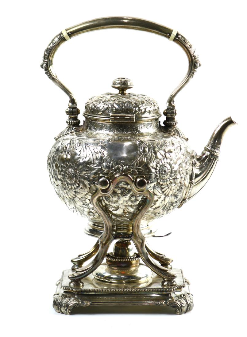Tiffany and Co: Tiffany and Co. sterling silver tea kettle on stand, the spherical kettle having a foliate repousse motif, marked on base "Tiffany & Co./3930 MAKERS S2449/ STERLING SILVER/ 925-1000/ M"; together with