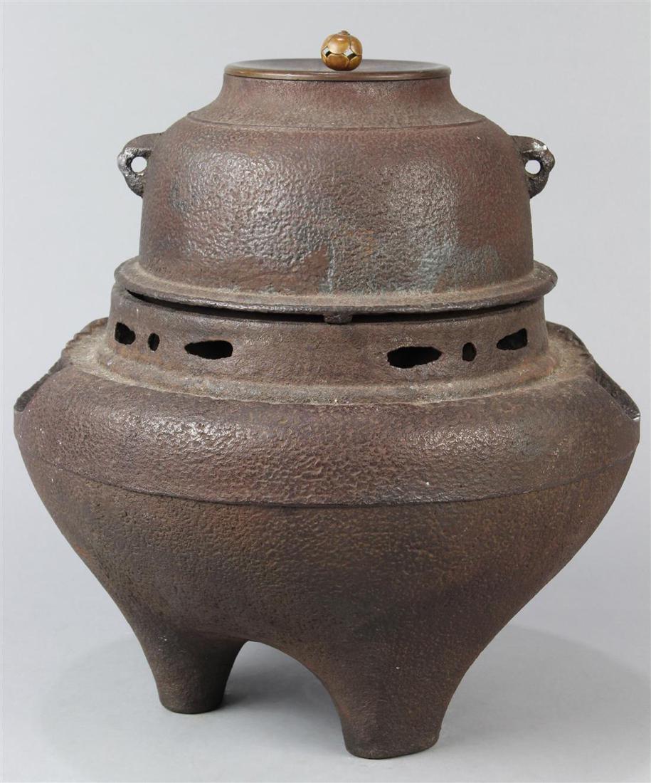 Japanese Iron Furo Chagama (Tea Kettle) for Tea: Set of Japanese furo (portable brazier) and iron chagama (tea kettle) for tea ceremony: chagama with compressed bulbous body, bud shaped finial on the lid; set above the furo with two openings on trip