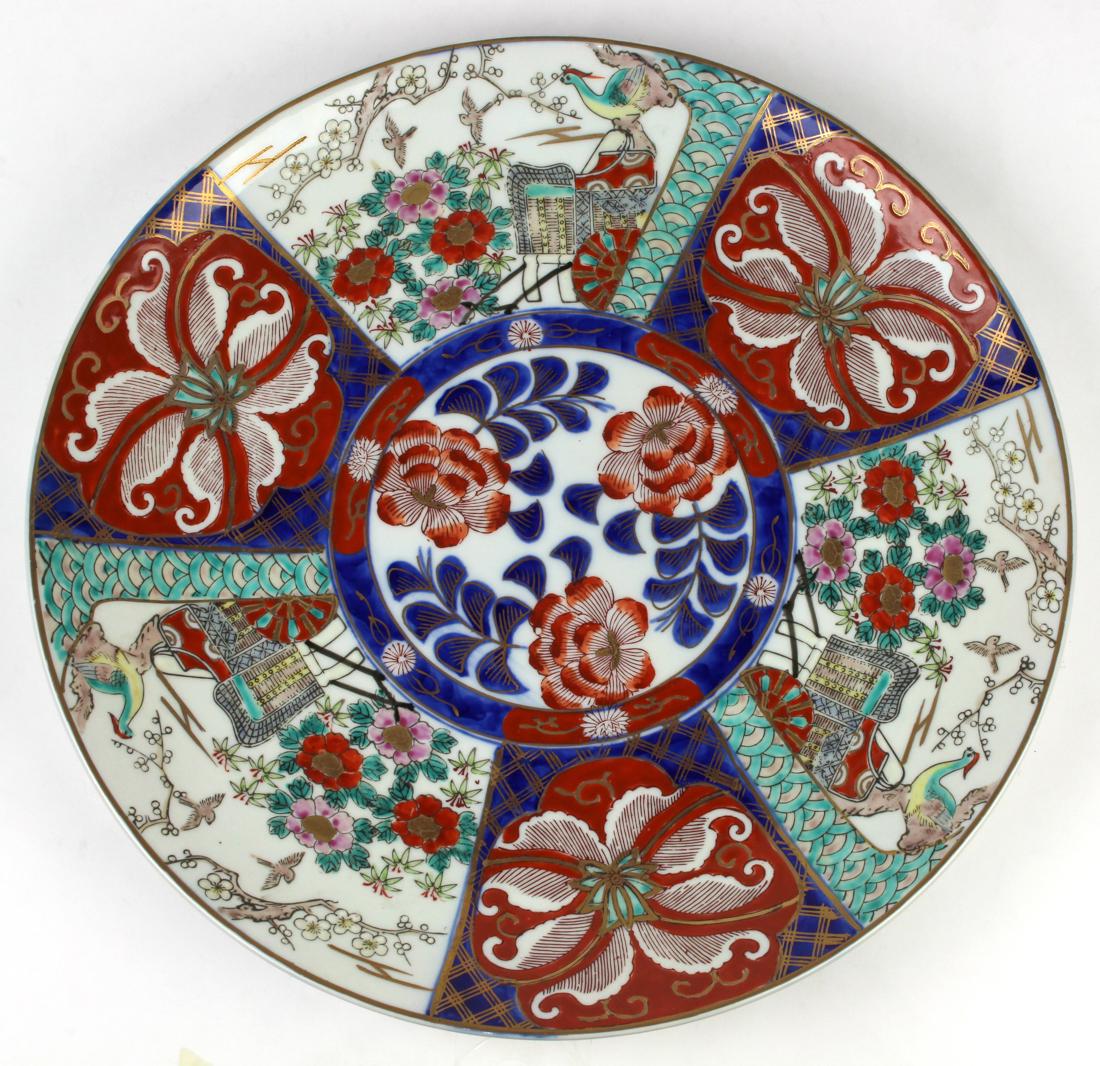 Japanese Imari Charger, Arita: Japanese Imari charger, center with peonies surrounded by ox cart, birds and flowers in panels in gilt and colors, base marked "Arita-yaki", approx. 15"dia