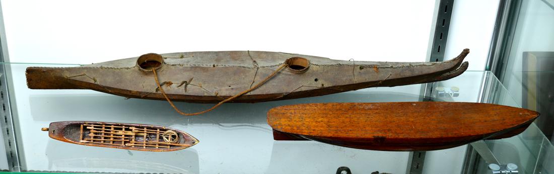 (lot of 3) Boat model group, including Inuit or Eskimo: (lot of 3) Boat model group, including Inuit or Eskimo style skin kayak model, a small hand carved model of a whale boat, together with a hull model of a sailing ship, largest: 27"l, Provenance: Spe