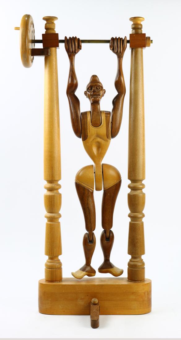 Articulated wood carved figure with stamped signature (1 of 3)