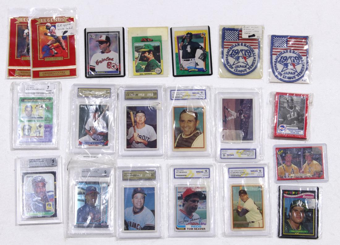 Two shelves of associated collectible sports cards (1 of 2)