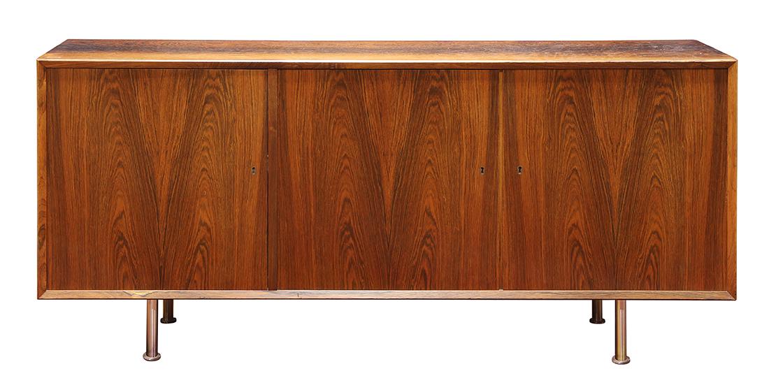 Danish Modern rosewood credenza circa 1960: Danish Modern rosewood credenza circa 1960, having a rectangular top, above three doors, and rising on spun steel legs, 26"h x 59"w x 17"d