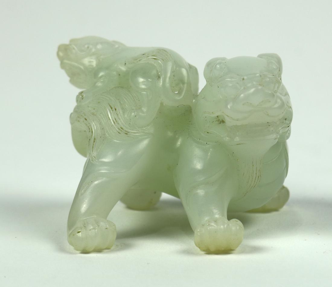 Chinese Jade Fu-lion: Chinese jade carving, of a fu-lion cub perched on the back of its parent, executed from a pale celadon matrix, 2"w; Provenance: reputed from the collection of C. Philip Cardeiro