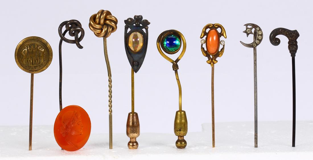 (Lot of 9) Multi-stone, glass, 10k yellow gold and: (Lot of 9) Multi-stone, glass, 10k yellow gold and metal stickpins Including 1) coral, seed pearl and 10k yellow gold stickpin, 1.7 grams; 1) carved carnelian intaglio stickpin, 18 X 15 mm; 3) glass a