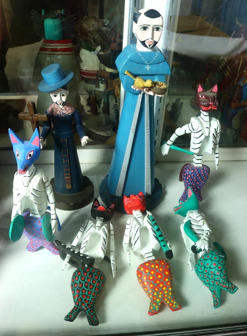 (lot of 7) Dia de los Muertos figurines including: (lot of 7) Dia de los Muertos figurines including felines playing musical instruments, together with a figure of a priest grasping a cross, signed San Cayetano, Anita Romero Jones, Santa Fe, and anoth