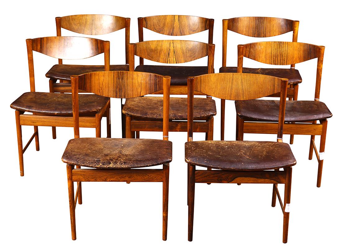 Ib Kofod Larsen for Säffle Möbelfabrik palisdaner: (lot of 8) Ib Kofod Larsen for Säffle Möbelfabrik palisdaner chairs, Sweden, circa 1960, each having a shaped back, above a brown leather seat, and rising on tapered legs, 29"h