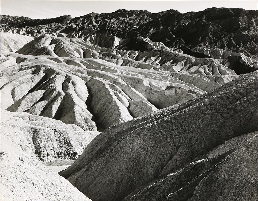 Photograph, Ansel Adams, Zabriskie Point, Death Valley: Ansel Adams (American, 1902-1984), "Zabriskie Point, Death Valley National Monument," circa 1942, gelatin silver print, titled in ink verso, inscribed in pencil verso, "I-NP-671," artist stamp "Photog