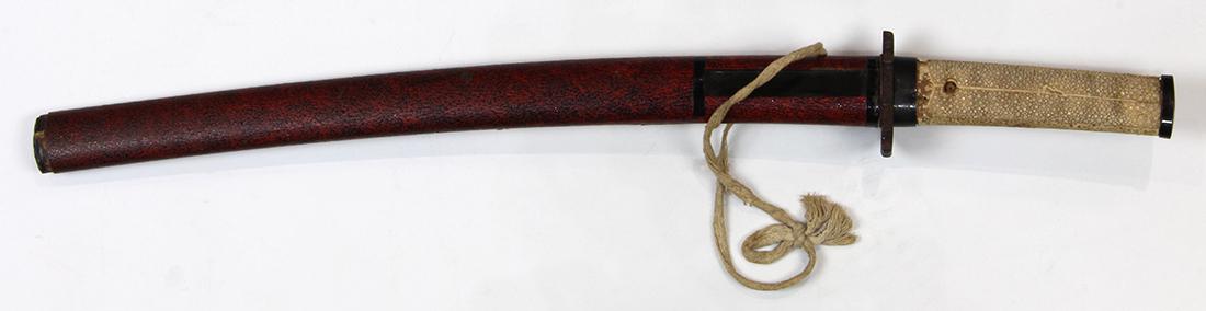 Japanese Katana Sword/Wakizashi: Japanese katana, blade from the Muromachi period (1336-1573), shortened and converted to wakizashi, the mounting from the late Edo period, ray skin handle, iron tsuba, red lacquered saya, overall (in 