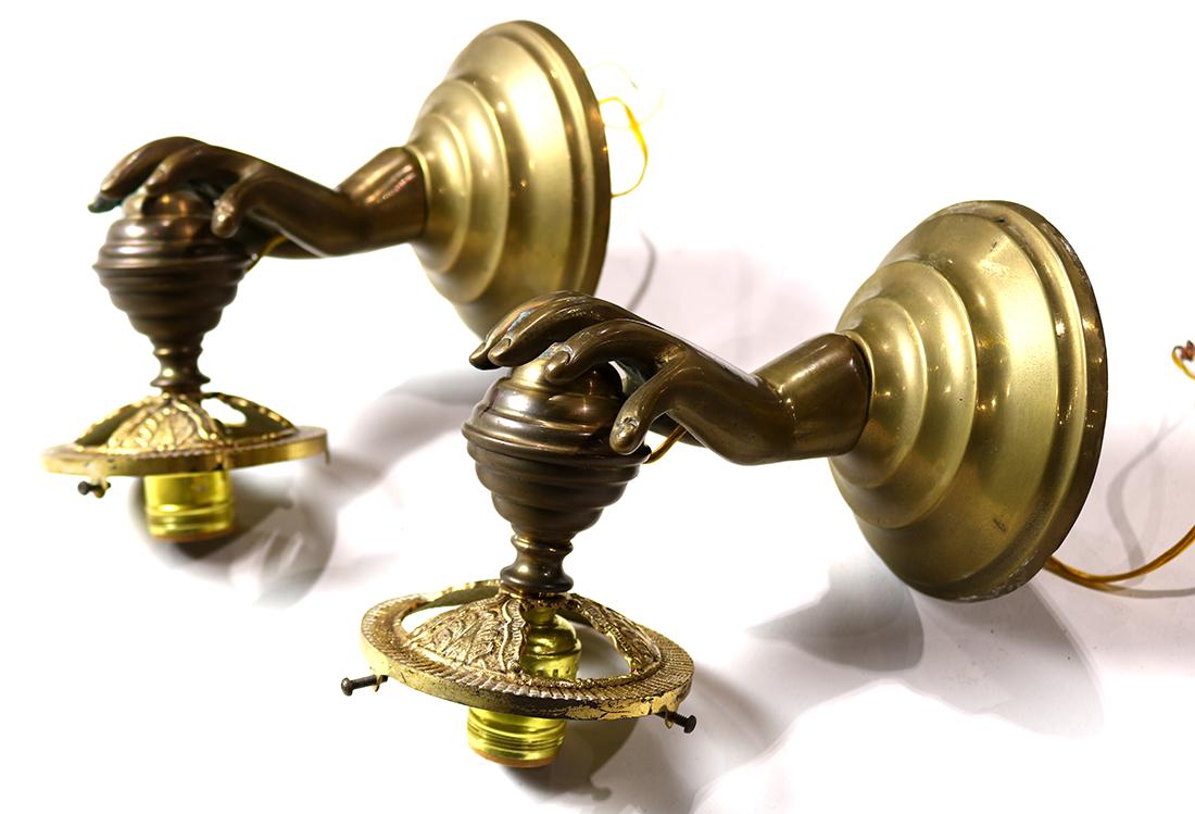 Pair of Italian brass figural wall sconces executed in (1 of 1)